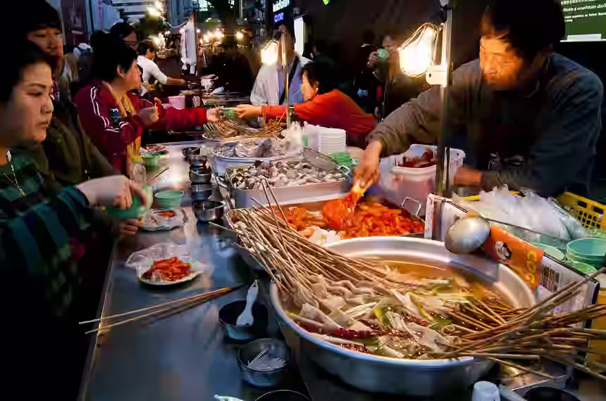Street food vendors at a night market in Seoul